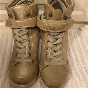 Metallic gold wedge sneakers